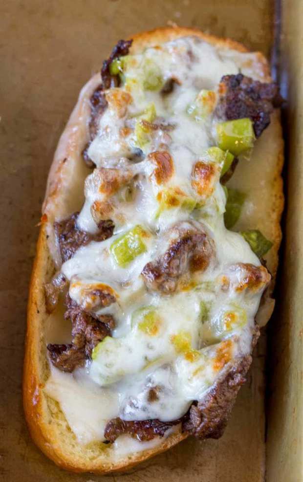 Oven Baked Philly Cheesesteak Sandwiches made for a crowd in just 30 minutes. Hot and freshly baked sandwiches for a crowd with none of the hard work!
