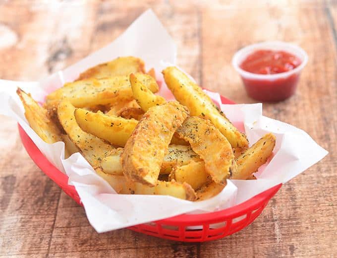Baked Parmesan Potato Wedges are golden, crisp and loaded with delicious Parmesan and garlic flavors yet baked for a less-guilt snacking!