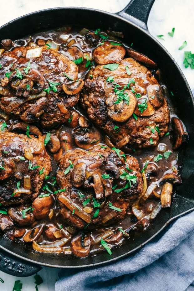 Skillet Salisbury Steak is a classic meal with a mouthwatering tender beef patty drowning in a rich homemade brown gravy.  Serve it over some mashed potatoes and peas and you have yourself a winner!