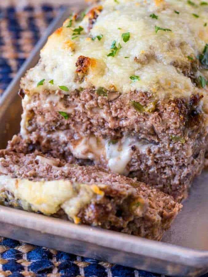 Philly Cheesesteak Meatloaf with green bell peppers, onions and mushrooms topped and stuffed with Provolone Cheese.