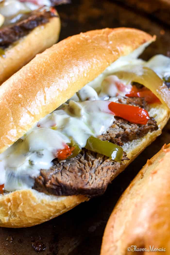 This easy Crockpot Philly Cheese Steak uses a slow cooker to make this Philly Cheese Steak juicy, tender, and delicious for awesome sandwiches for a football game or any time!