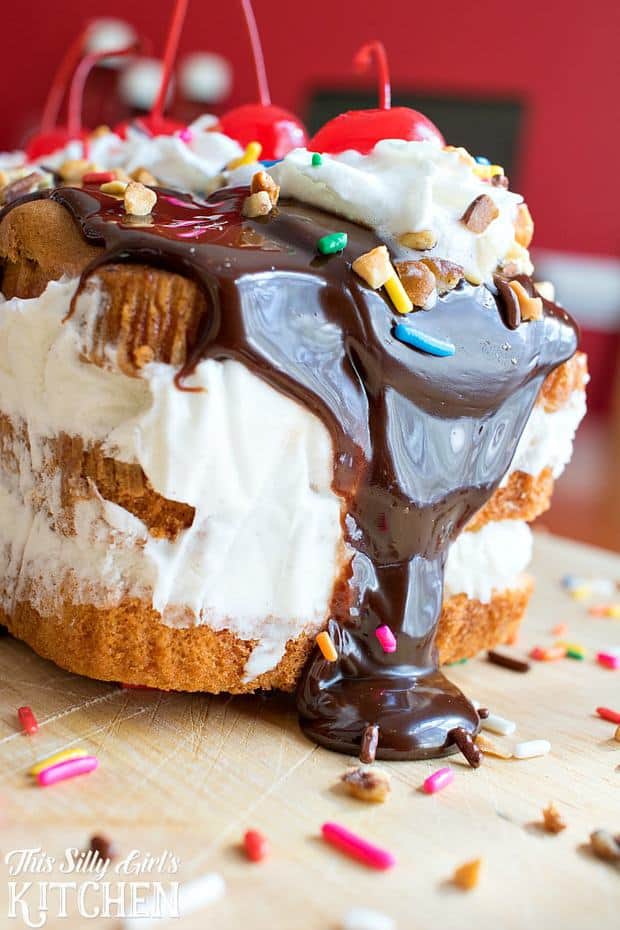 Hot Fudge Sundae Ice Cream Cake, layers of vanilla ice cream between pound cake, topped with classic sundae toppings!