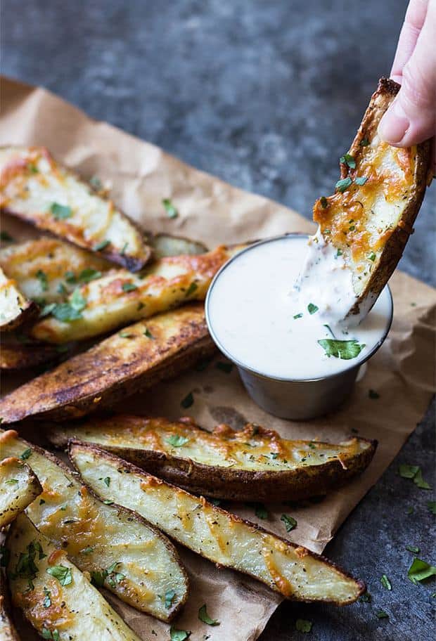 These Baked Herb Parmesan Potato Wedges are so easy to make from scratch (and taste a million times better than frozen!).