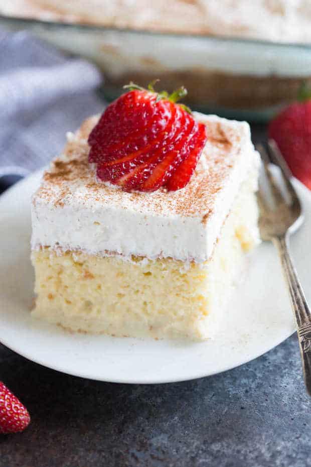 The BEST authentic homemade Tres Leches Cake. An ultra light cake soaked in a sweet milk mixture and topped with fresh whipped cream and cinnamon. This simple Mexican dessert is one of our favorites!