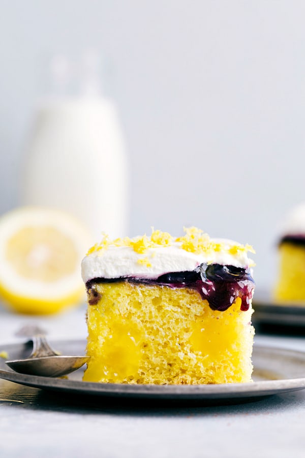 Lemon Blueberry Poke Cake is a tender and moist lemon cake filled with lemon curd topped with a blueberry filling and whipped topping.  This is a perfect summer cake and will be a hit wherever it goes!