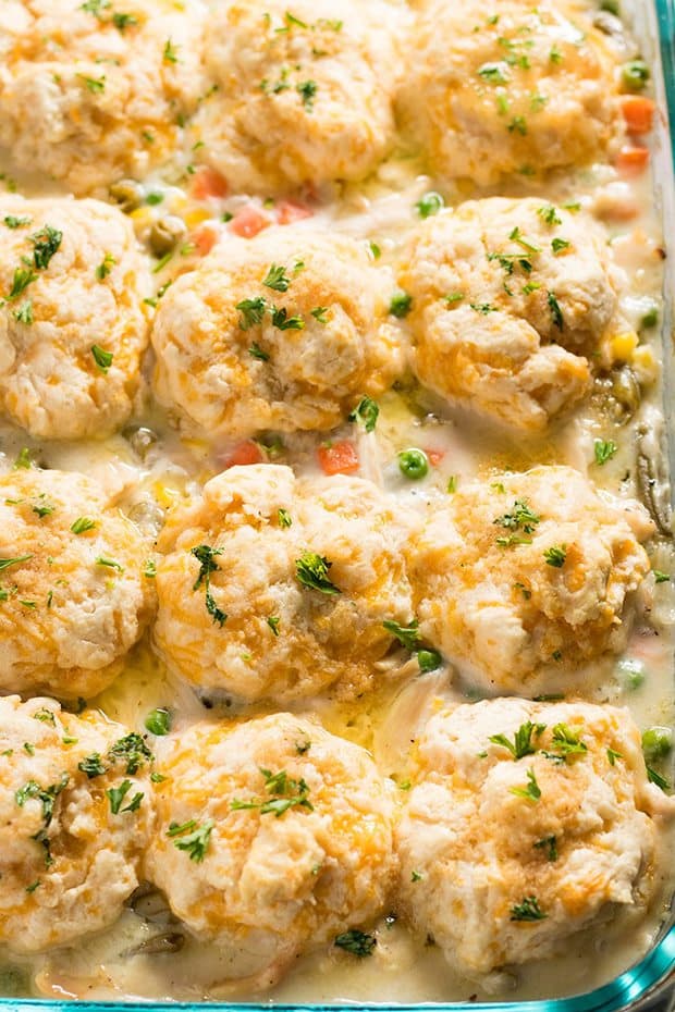 This Chicken Pot Pie is creamy and comforting, while being made easy into a chicken casserole!  Topped with cheddar drop biscuits that take only five minutes to make, this satisfying pot pie will be on your dinner table in 40 minutes or less!
