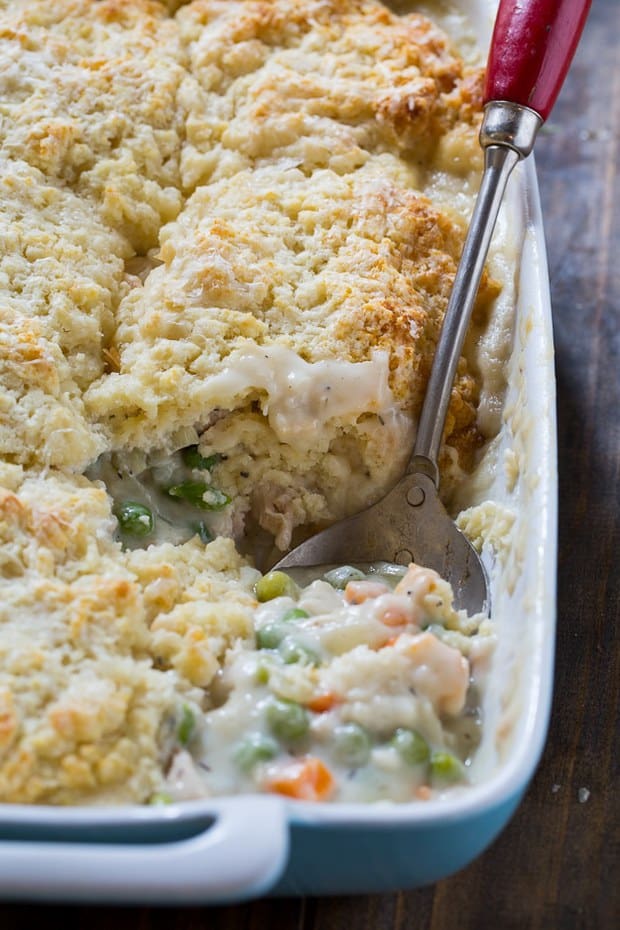 Chicken Pot Pie with Biscuit Topping has a creamy filling with lots of chicken, peas, and carrots and a light and fluffy biscuit topping. Makes a filling family meal and leftovers reheat well.