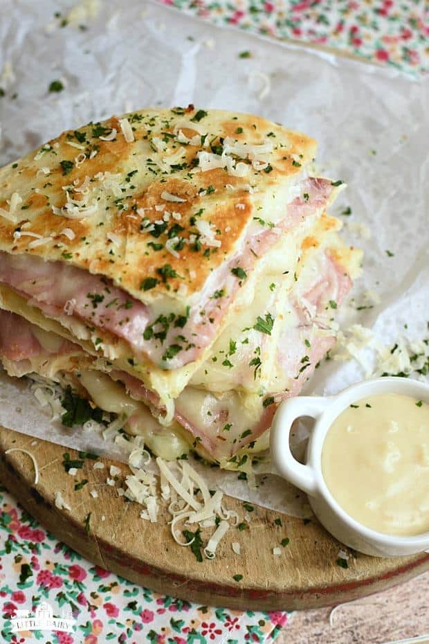 There’s so much to love about Chicken Cordon Bleu Quesadillas! They have all the same irresistible flavors of traditional, and time consuming Chicken Cordon Bleu in this super EASY quesadilla! There’s layers of gooey cheese, crispy bread crumbs, savory ham and chicken and of course killer Parmesan Dijon cream sauce that you could eat with a spoon! It’s a winner!