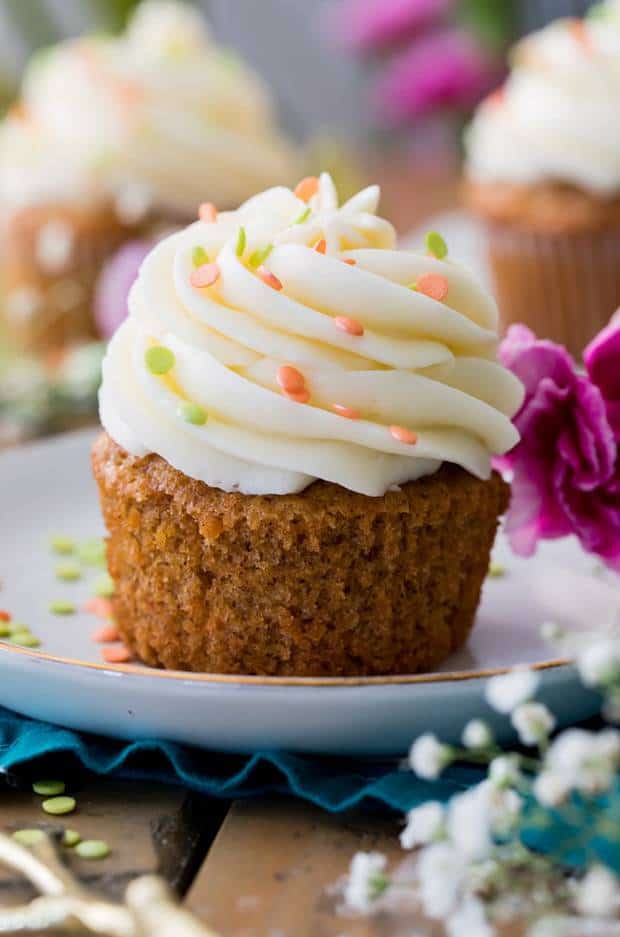 Soft, fluffy, and moist carrot cake cupcakes! Made completely from scratch with real grated carrots and the option to add nuts or raisins, these cupcakes are always a hit! Make sure to top them off with the absolute best cream cheese frosting