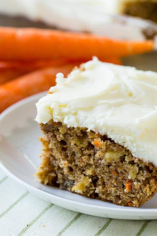Pineapple Carrot Cake is super moist and has lots of spice flavor. Made in a 9X13-inch pan, it’s easy to cut into squares and share. The cake is covered in a rich and creamy cream cheese icing.
