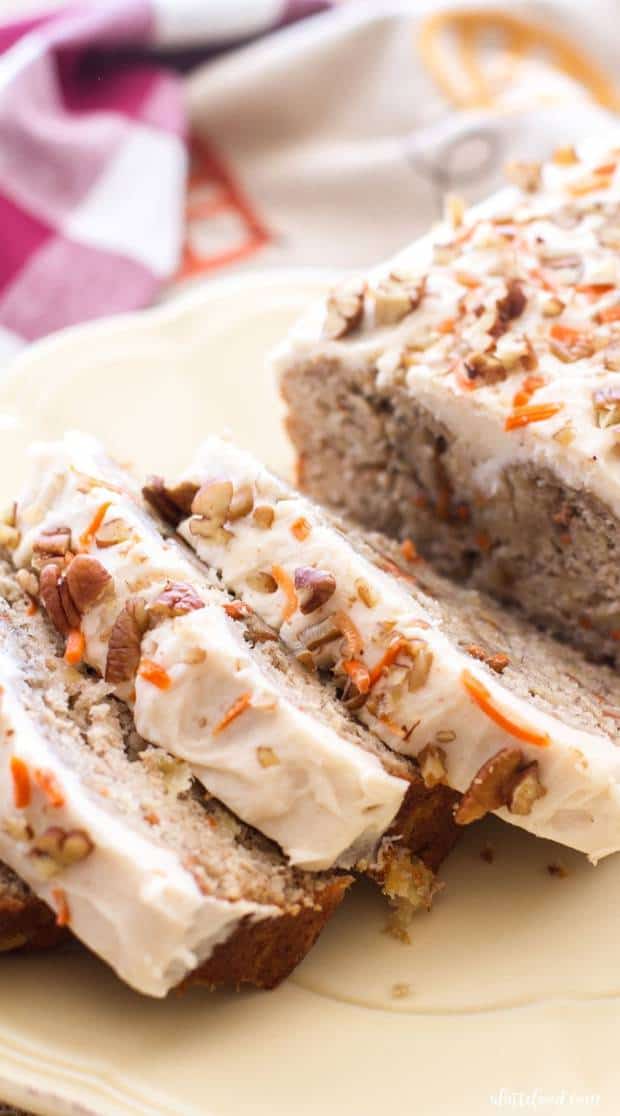 Carrot cake meets banana bread in this easy quick bread recipe! Moist, flavorful, and topped with rich homemade cream cheese frosting, this carrot cake banana bread is the ultimate dessert bread! A perfect Easter dessert!