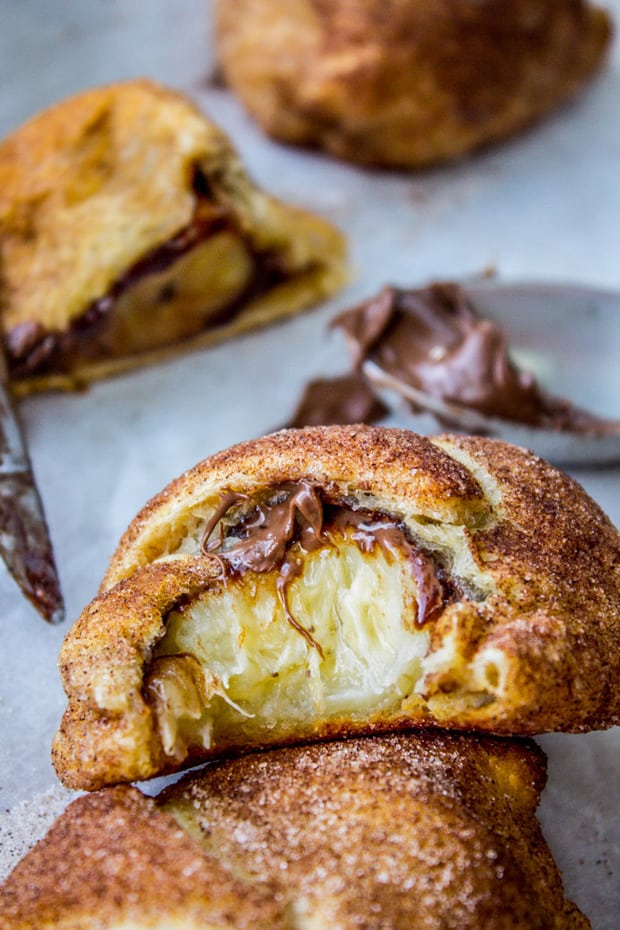 Stuff a buttery crescent roll with banana and a schmear of Nutella, roll it in cinnamon sugar, and bake. This is the easiest recipe for happiness, in 10 minutes flat.