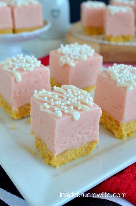 A cookie crust and white chocolate drizzles makes this Strawberry Shortcake Fudge a fun no bake dessert for any party