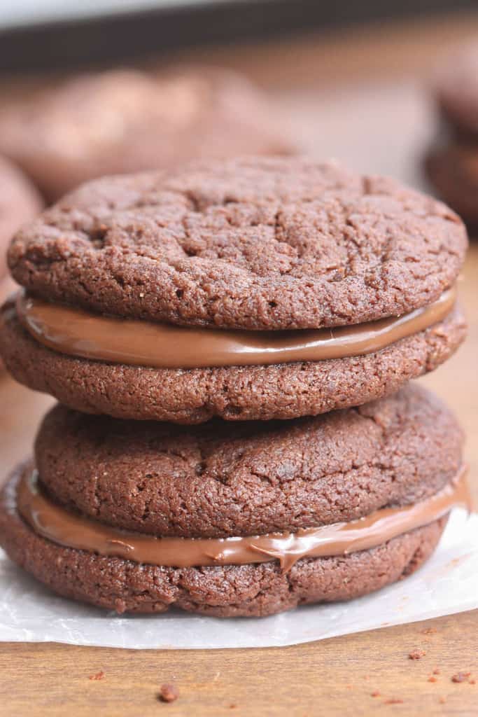 Thick and chewy chocolate cookies made into a sandwich cookie with Nutella in the center.