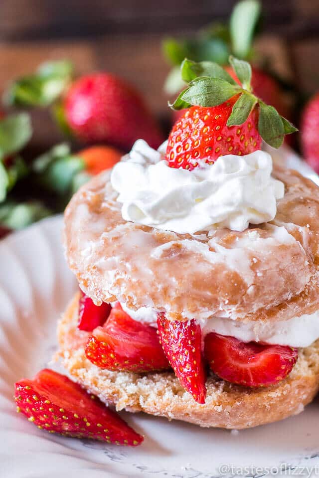 Breakfast and dessert heavens collide with this Donut Strawberry Shortcake. Strawberries in syrup top a sliced donut, soaking in to make the easiest shortcake ev