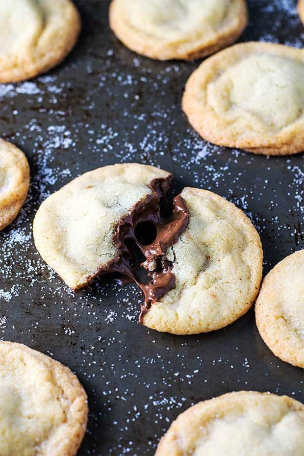 Old fashioned soft and chewy sugar cookies stuffed with creamy chocolate and hazelnut Nutella. Trust me, this combination is as delicious as it sounds!