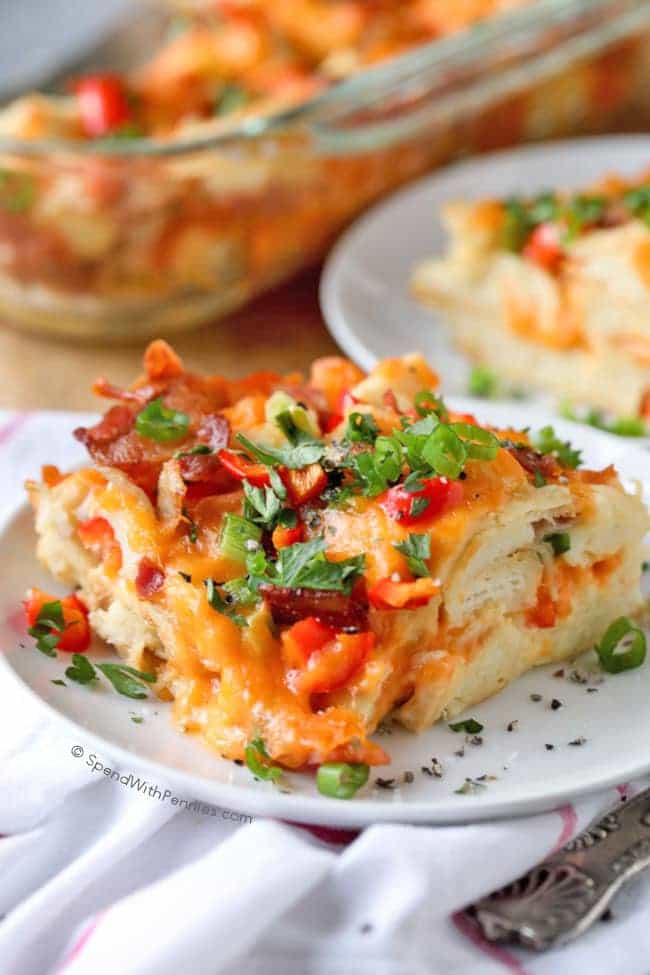This easy Overnight Breakfast Casserole is quick to prep in the evening and then baked up fresh and delicious in the morning!  Cheese, bacon, bell peppers and green onions are layered with bread and soaked in a seasoned egg mixture.  This is the perfect meal to serve on a holiday morning or for guests.