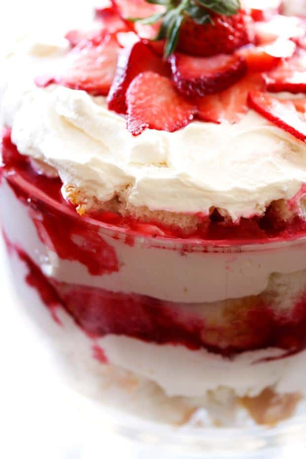 A light and delicious trifle layered with strawberry sauce, angel food cake and whipped cream! This will be a hit wherever it is served!