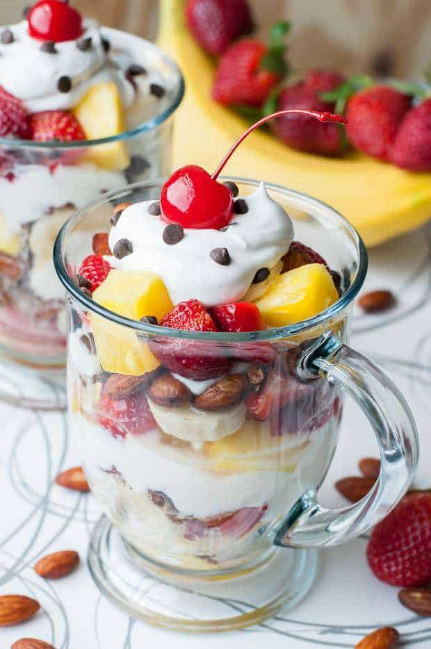 These healthy Banana Split Parfaits are loaded with fresh fruit, naturally sweet cocoa roasted almond granola, vanilla yogurt, and a kiss of coconut whipped cream. Let’s brunch it up!
