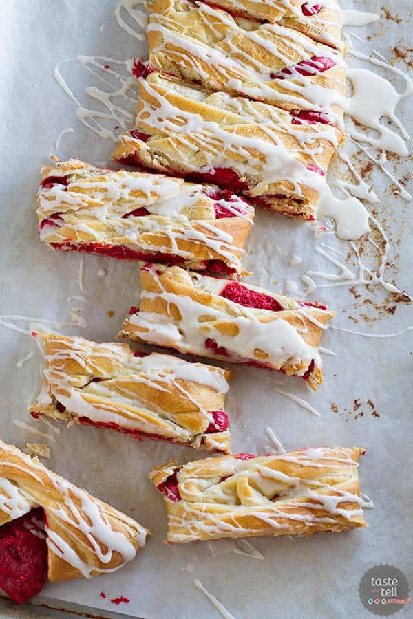 This easy cream cheese danish goes red velvet! A creamy red velvet center is surrounded by crescent dough and baked to perfection. An easy glaze finishes off this danish that is perfect for breakfast or brunch.