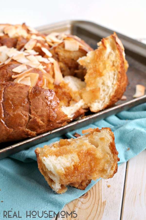 If you are looking for a sweet tropical treat that will feed a crowd, you can’t go wrong with this easy to make PIÑA COLADA PULL-APART BREAD!