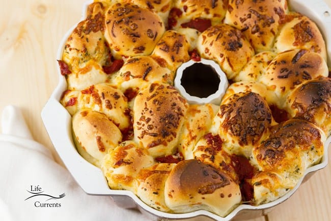 This Pizza Pull Apart Bread is the bomb! Easy to make, and super delicious! Besides, isn’t it fun to pull things apart and eat them with your fingers! This bread didn’t last long in the house – we noshed