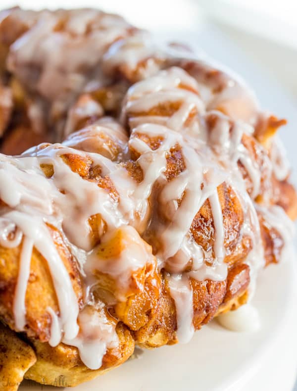 Delicious cinnamon rolls are cut up and combined with cream cheese and a brown sugar glaze to make this Cream Cheese Caramel Roll Pull Apart Bread a breakfast favorite.