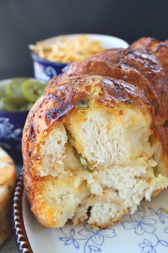 Who doesn’t love bread? Who doesn’t love cheese? And… who doesn’t love monkey bread? Well, you are in for a treat! This three alarm cheesy onion monkey bread is totally the bomb! This delicious monkey bread will have your family asking for more!