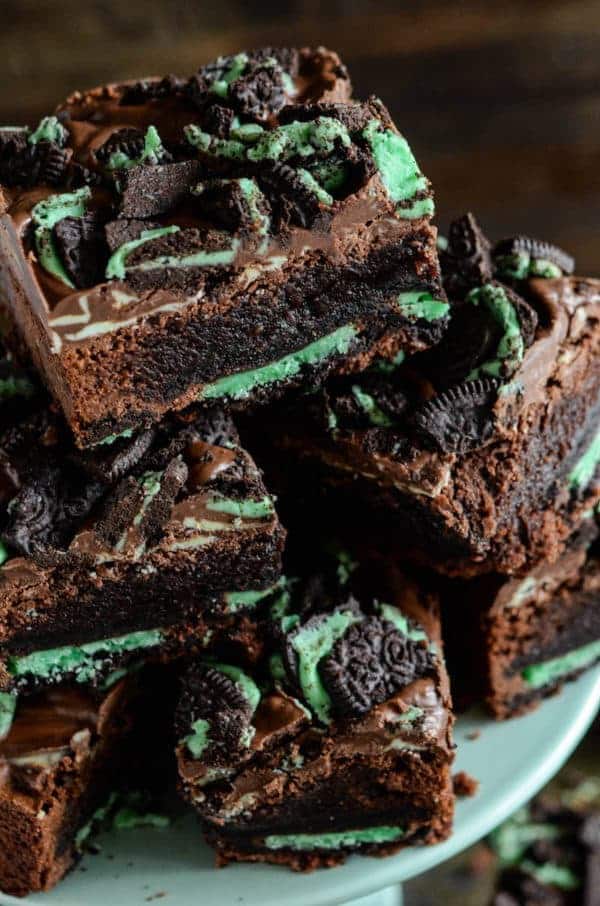 Ultimate mint brownies: rich chocolate fudge brownies, with a layer of mint oreo cookies baked into them, are topped with andes mints & crushed mint oreos!