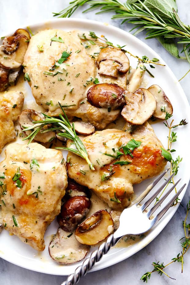 Creamy Garlic Herb Mushroom Chicken is a quick and easy 30 minute meal with amazing restaurant quality taste! The creamy garlic and fresh herb mushroom sauce over this chicken is insanely delicious!