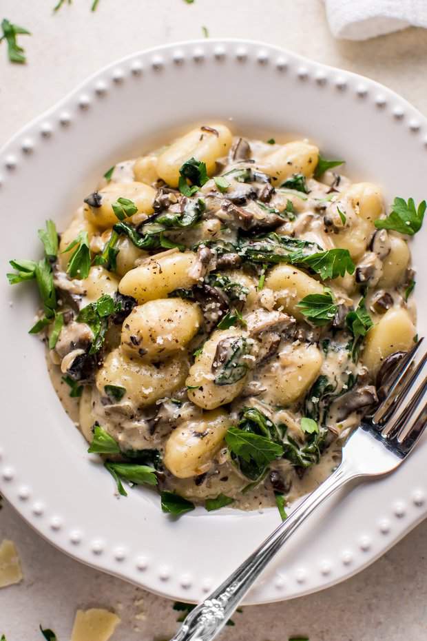 This creamy mushroom and spinach gnocchi is a restaurant-worthy dinner made in one pan and ready in less than 30 minutes! White wine and parmesan cheese make this sauce extra amazing.