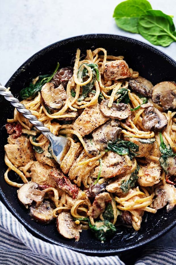 One Pot Creamy Chicken Mushroom Florentine is ready in under 30 minutes! Everything is made in just one pot and it is filled with sun dried tomatoes, spinach, mushrooms and the creamiest pasta!