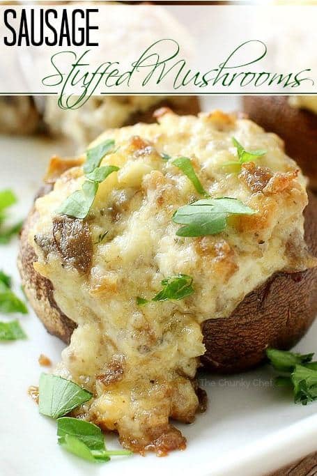 tuffed mushrooms are perfect to serve at a party, and your guests will be raving about these!  Filled with the most delicious filling with wine, cheese, Italian sausage, herbs and more!