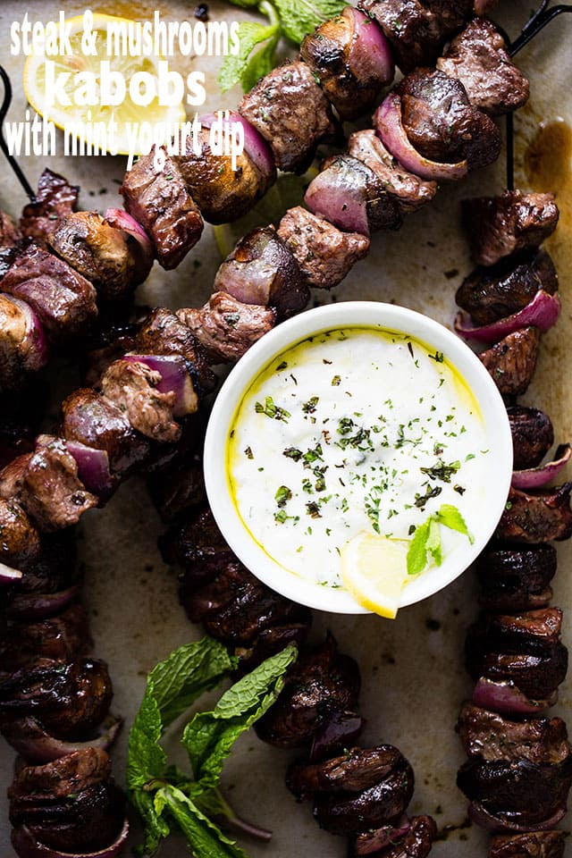 Deliciously marinated steak kabobs with mushrooms and red onions grilled to a tender perfection and served with an amazing mint yogurt dip!