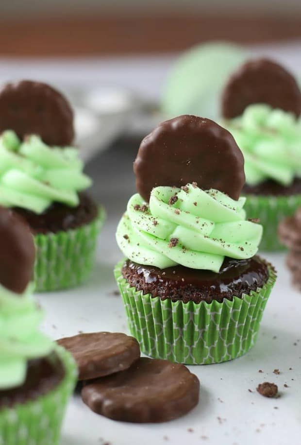 Thin Mint Cupcakes are rich chocolate cupcakes smothered with chocolate ganache and minty frosting, then topped with Thin Mints! Girl Scout or not, this is a dream come true!