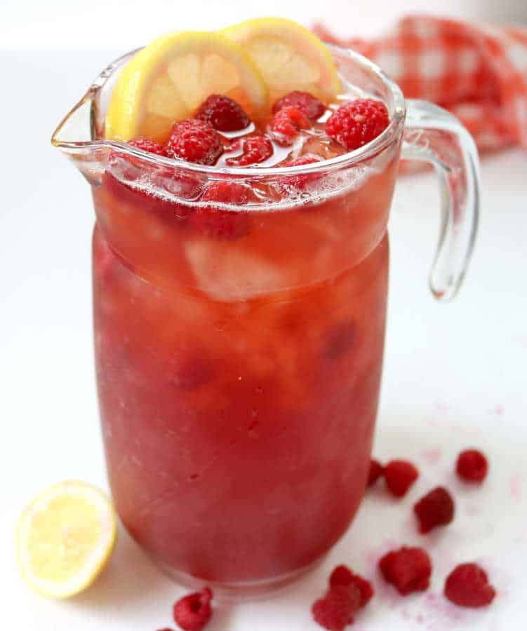 Fresh Raspberries and Southern Sweet Tea come together to make one delicious, refreshing and pure raspberry sweet iced tea and no simple syrup needed!!