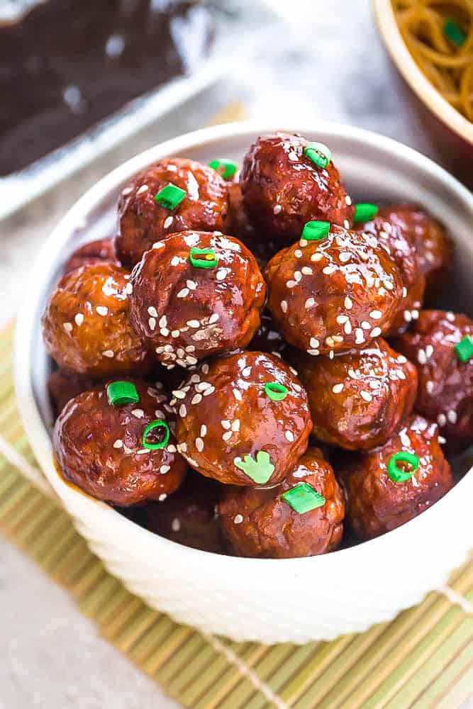 Asian Glazed Meatballs – moist and tender chicken meatballs are the perfect appetizers for game day or any Super Bowl parties. Best of all,  coated in a sweet and sticky glaze and come together easily in the Instant Pot, Slow Cooker or oven.