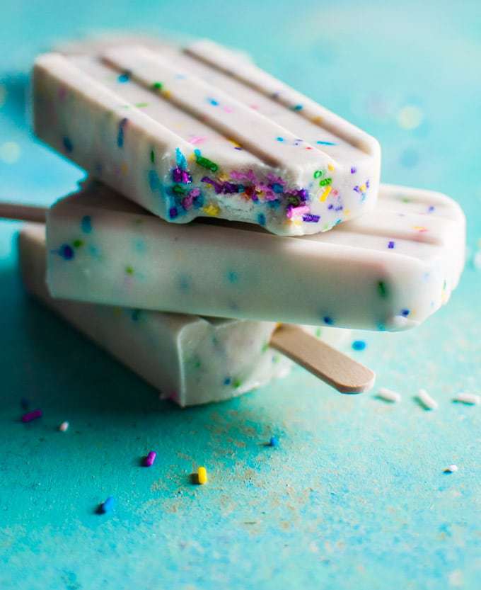 These vanilla Greek yogurt funfetti popsicles are super cute and easy to make – only 4 ingredients are needed! Kids and adults alike will love them!