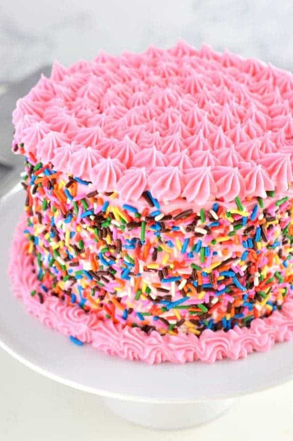 This gluten free funfetti cake is perfect for birthday celebrations. The gluten free and dairy free white cake is light and airy and filled with colorful sprinkles. Finish it off with dairy free frosting and extra sprinkles for the ultimate funfetti experience!