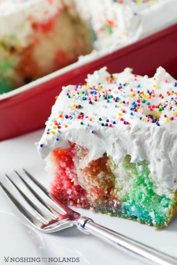 Need a fun birthday cake that is super easy to make? I have for you Rainbow Birthday Poke Cake that young and old would love to have!!