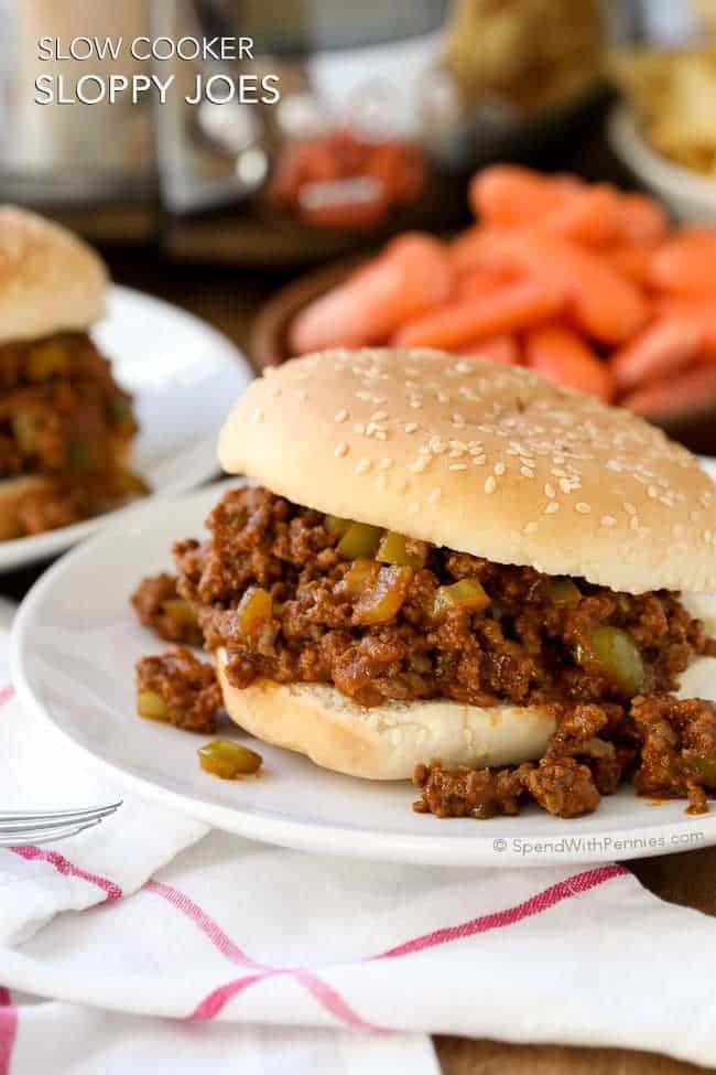 These Slow Cooker Sloppy Joes are the perfect way to feed a crowd because they can be prepared up to 24 hours in advance.  Ground beef and peppers are cooked in the Crock Pot in a quick zesty sauce for a family favorite meal that’s ready when you are!