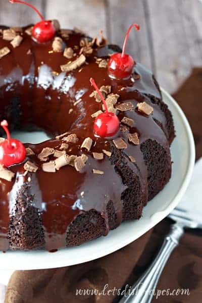 BLACK FOREST TRUFFLE CAKE — A decadent chocolate cherry cake with a tunnel of chocolate truffle filling inside and a rich chocolate ganache glaze on top