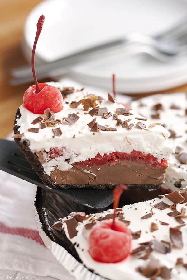 Black Forest Ice Cream Pie is a quick and easy no bake dessert recipe. Made with an Oreo Cookie crust, chocolate ice cream, maraschino cherries and whipped topping this pie is a pretty addition to any dessert table! It’s perfect for the holidays or to keep in the freezer “just because”!