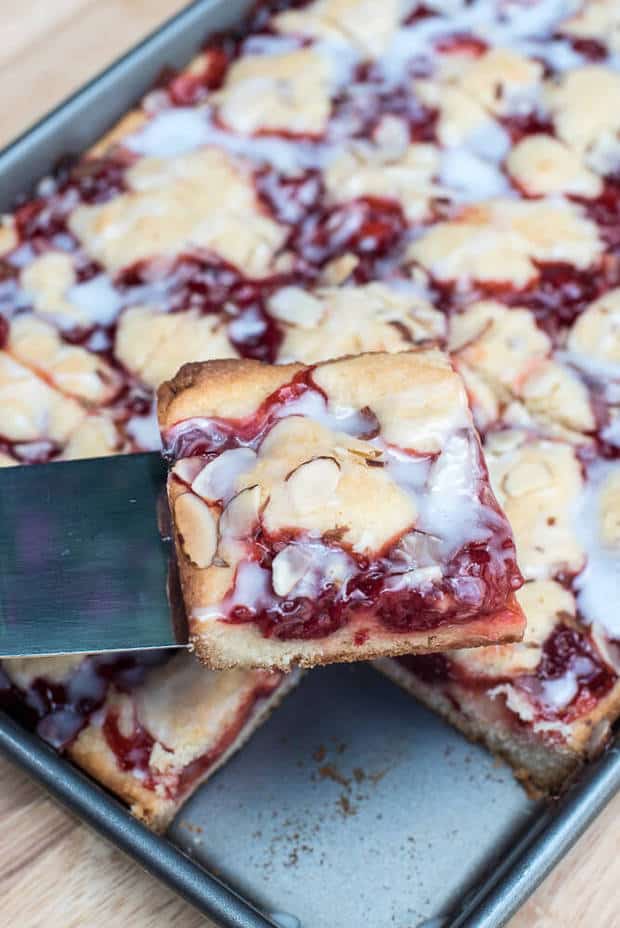 A tender crust topped with cherry pie filling and drizzled with a sweet, simple almond flavored glaze. These pretty bars are quick and easy to make and include ingredients you can easily keep stocked in your pantry.
