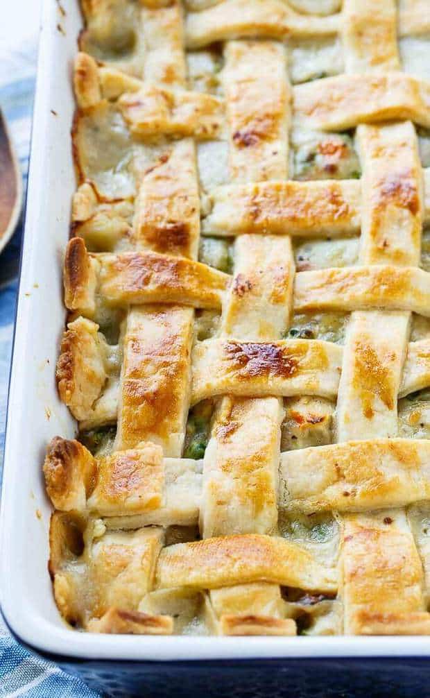 Chicken Pot Pie with Lattice Top is comfort food like no other. This family favorite has a thick and creamy filling loaded with chicken, carrots, and peas. On top is a Flaky Pie Crust done in a lattice pattern. This recipe perfectly combines the rich and savory flavors of a chicken pot pie into a casserole form.