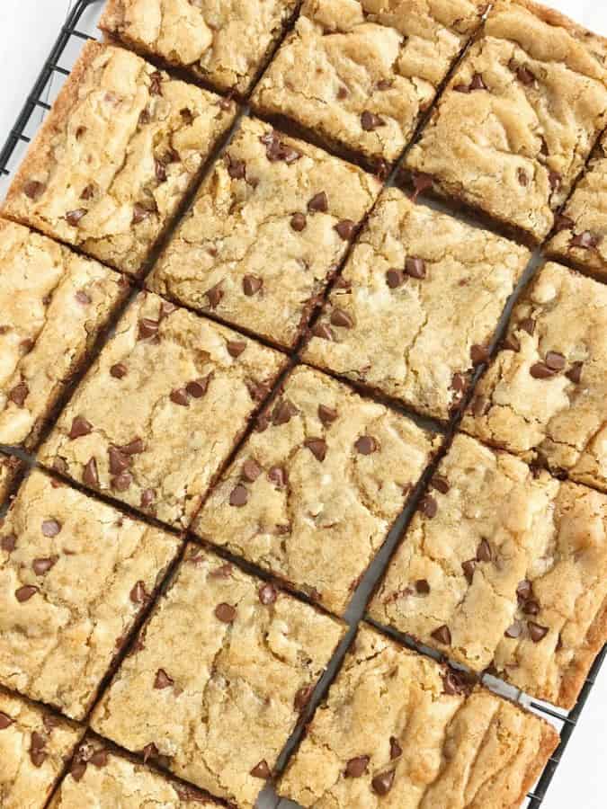 Chocolate chip cookie blondie bars are a chewy cookie bar loaded with chocolate chips and the best dessert! These bars bake in one pan and are so simple to make. They bake up perfectly sweet & chewy each time with crisp, buttery edges and a super soft middle. If you love chocolate chip cookies then you will want to make these.