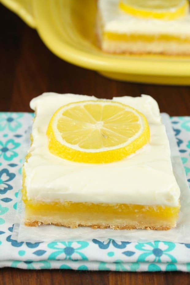 Lemon Bars with Cream Cheese Icing will be the most requested dessert for all of your summer cookouts and parties!