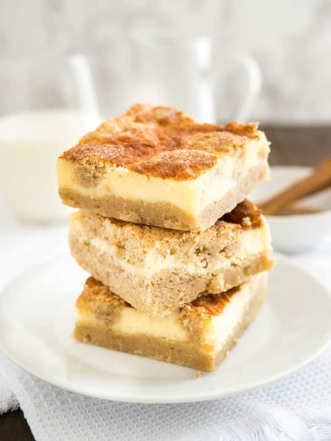 Snickerdoodle Cheesecake Bars are the best of both worlds with a creamy cheesecake top and a soft cinnamon-sugary snickerdoodle bottom.