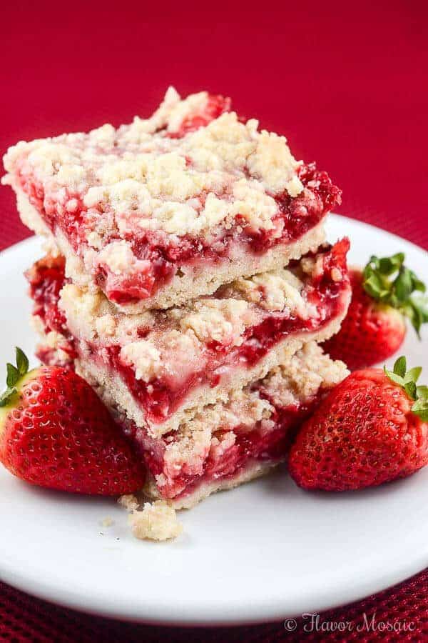 These easy Strawberry Crumb Bars, with a buttery crust, sweet fresh strawberry filling, and crunchy butter crumb topping make wonderful dessert bars for an afternoon snack, or to take to a summer party, picnic, or potluck.
