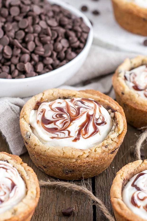 These chewy Chocolate Chips Cookie Cups are truly one of the easiest desserts you'll ever make. filled with vanilla cream cheese mousse and a swirl of chocolate sauce.